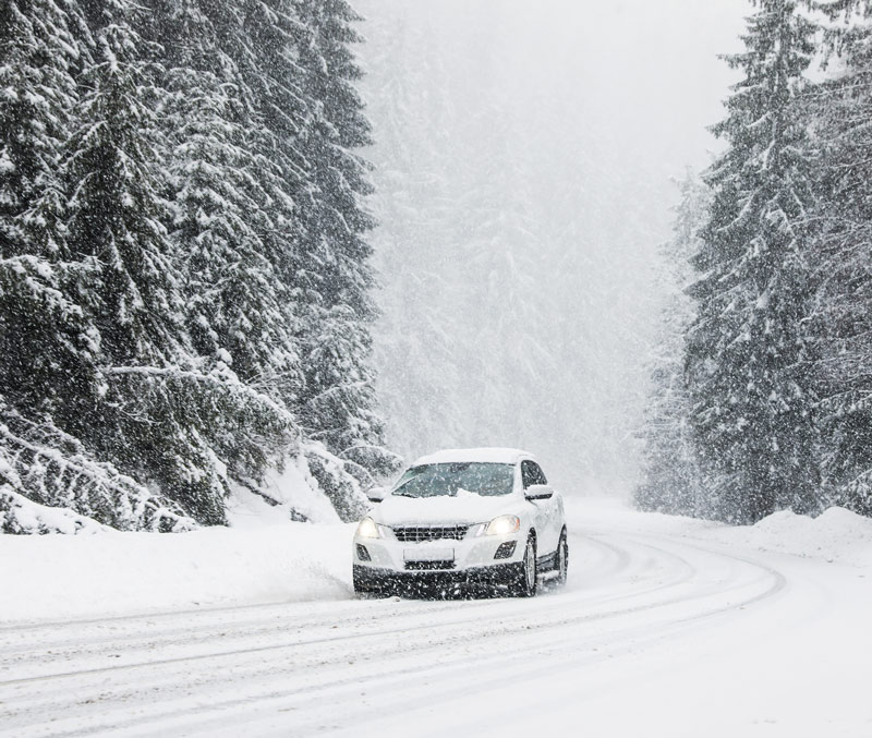 car in middle of snow storm